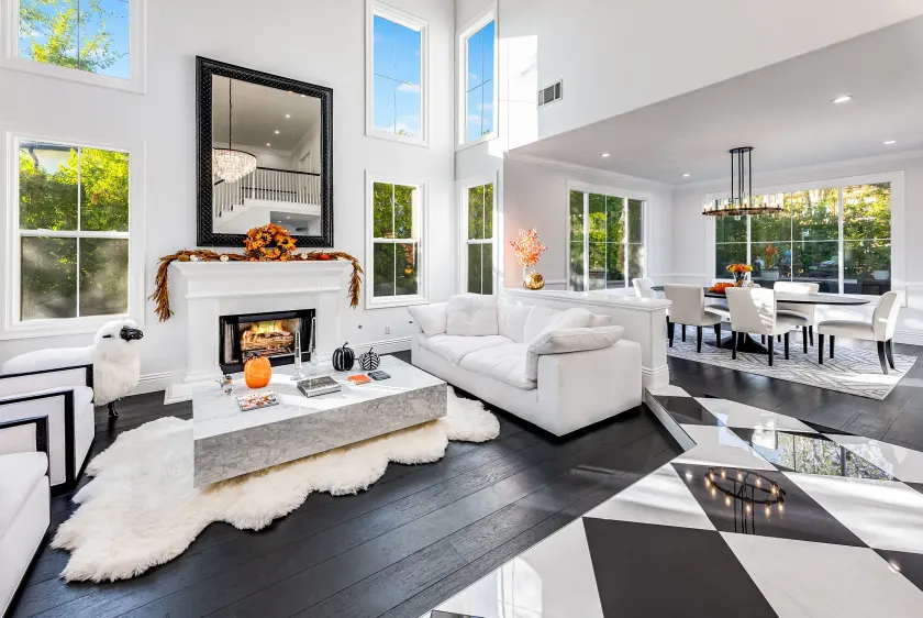Great room with fireplace opening to the kitchen in a Calabasas remodel