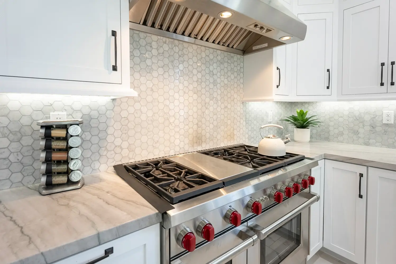 Range with pull-out spice rack and hexagon tile backsplash