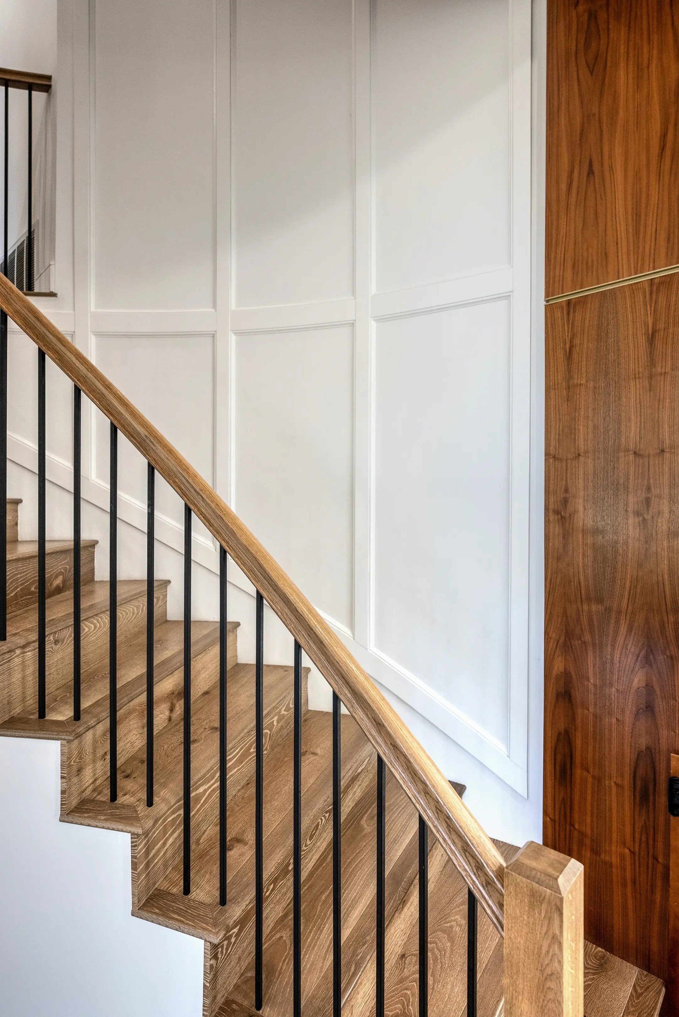 Rebuilt staircase with oak treads and metal railing