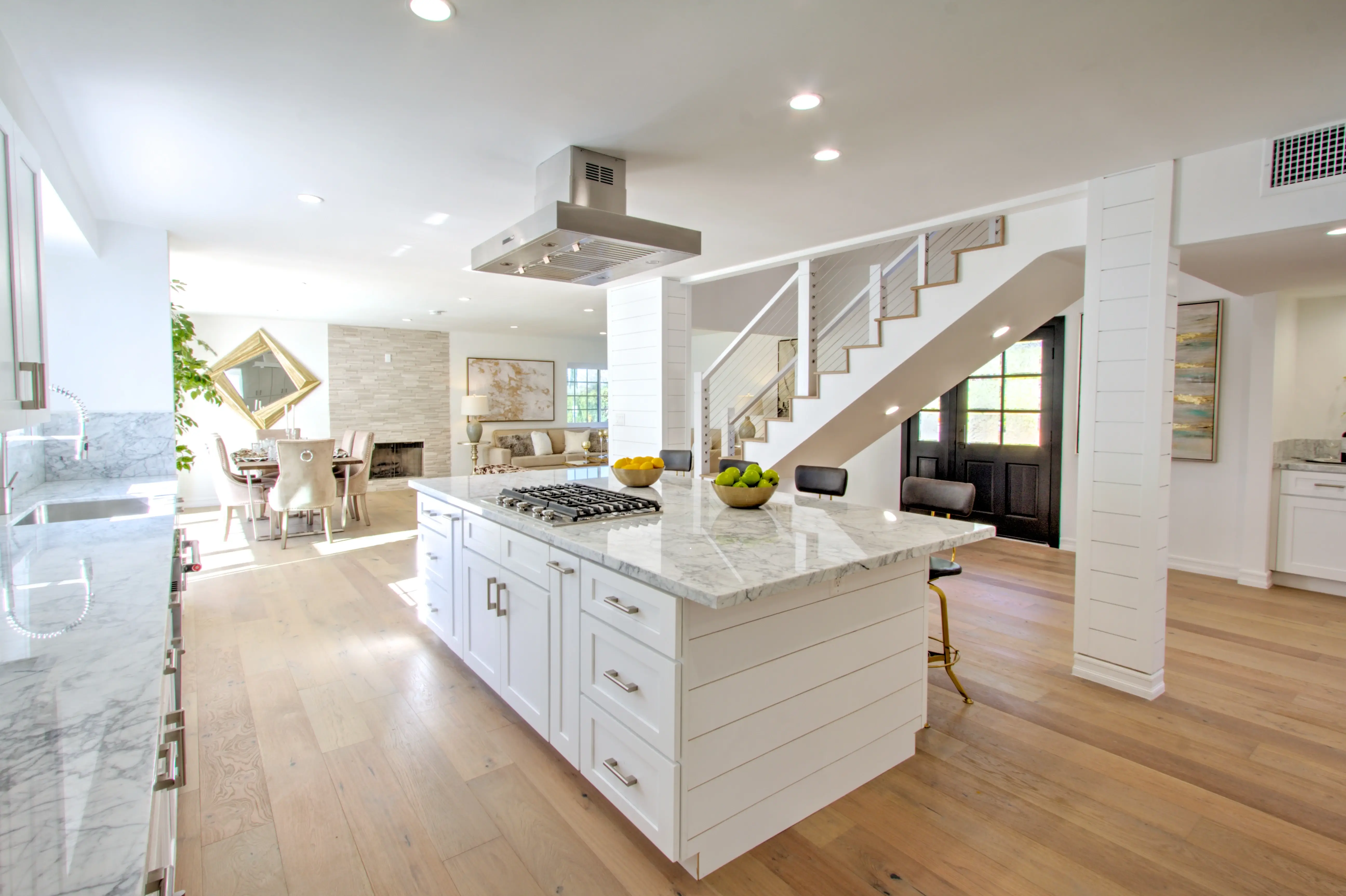 Kitchen opening to the living room and fireplace