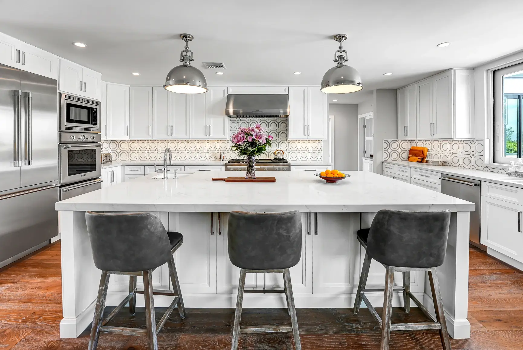 Island seating facing the range wall and double ovens