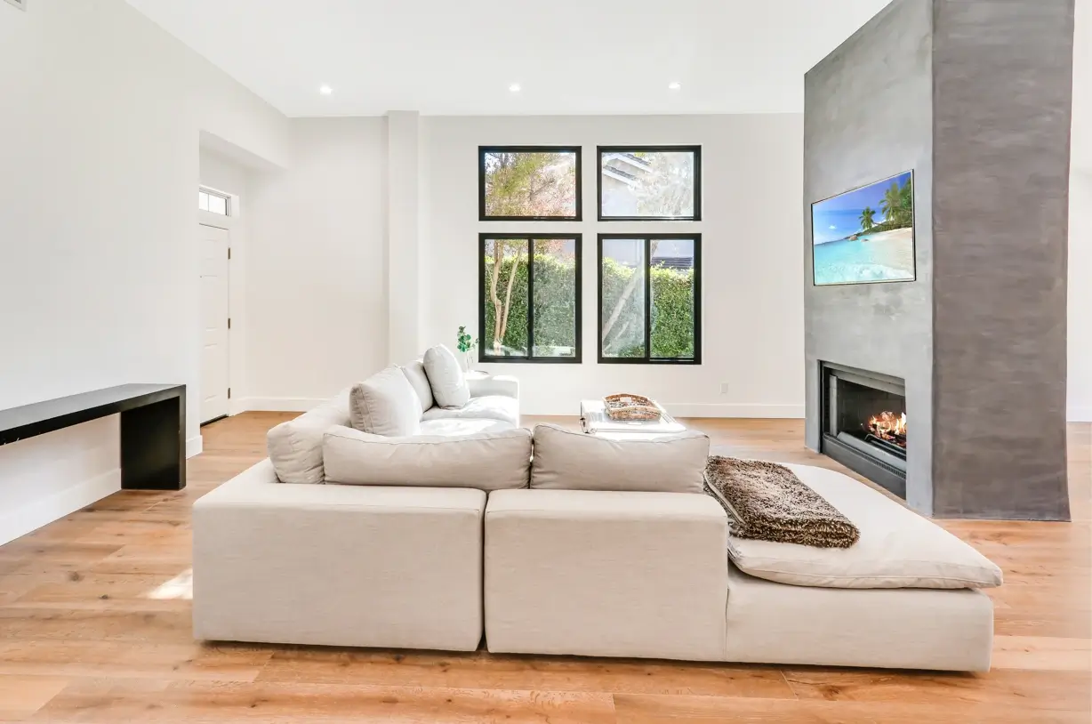 Family room with sectional, media wall and fireplace