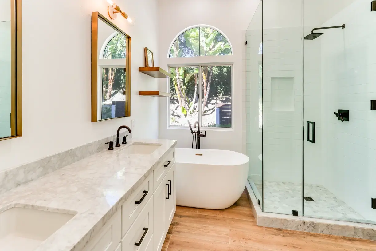 Primary bathroom with freestanding tub, double vanity and glass shower