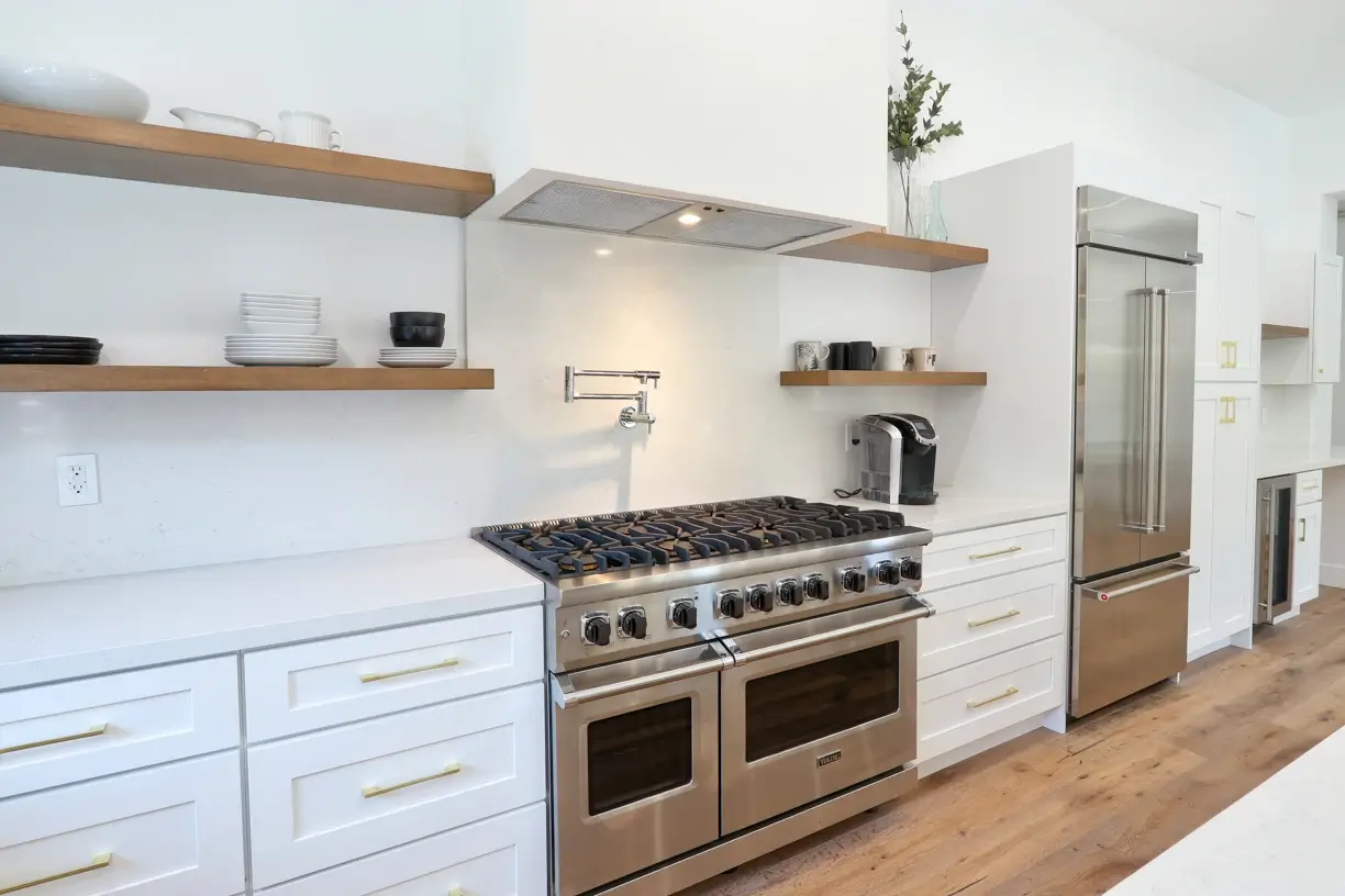 Professional range with pot filler and open oak shelving